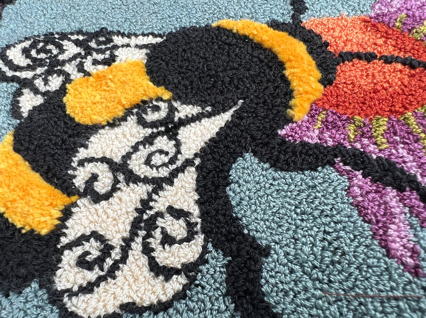 A Bee's Kiss- Paper Rug Hooking Pattern, by Orphaned Wool, Copyright © 2023 Kelly Kanyok. This is a beautifully designed pattern of a bumblebee feeding from a colorful flower. Paper patterns are designed for enlargement.