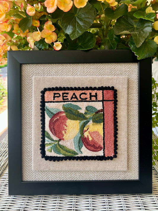 Peach- Punch Needle Pattern by Orphaned Wool, Copyright ©2025 Kelly Kanyok. Available in paper, cloth, printed patterns, or a set of four patterned designs (Fruit Series). Pattern features two colorful peaches with the word PEACH at the top of the design.