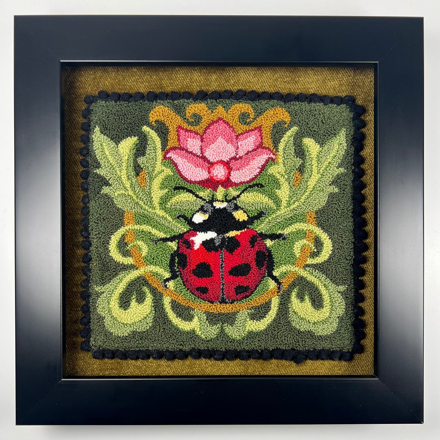 Ladybug Design on Leaves with a rose colored flower design by Orphaned Wool