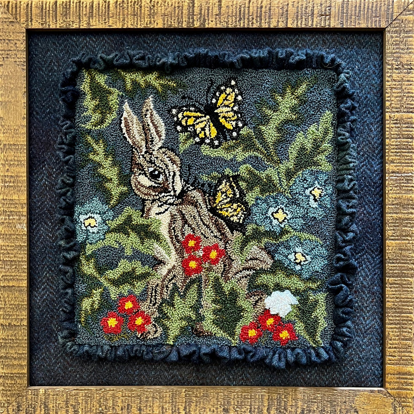 Hare with Friends PDF Digital Download Punch Needle Pattern by Orphaned Wool. This design is for anyone that loves bunnies and butterflies. This bunny is nestled in with flowers and foliage. makes a stunning finished design. DMC Floss was used in pattern.