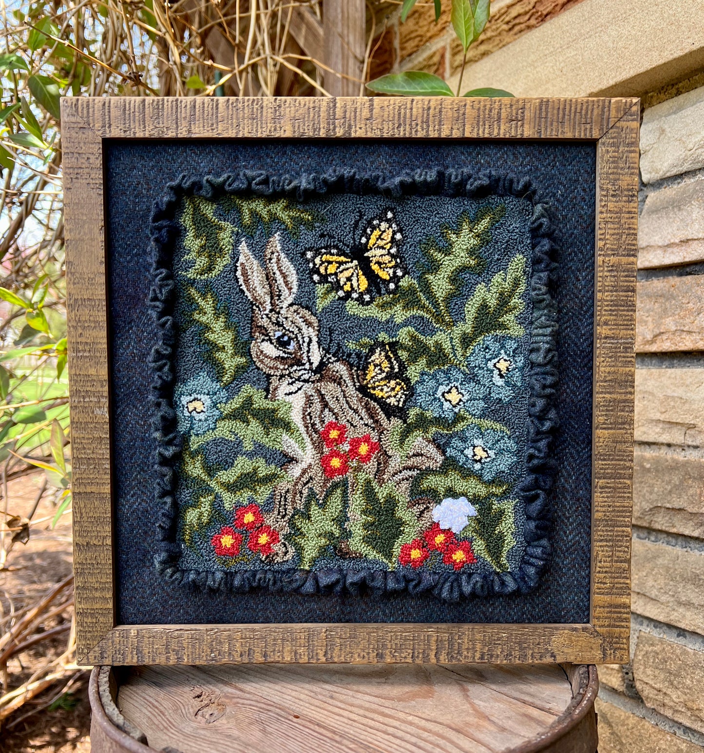 Hare with Friend Punch Needle Pattern by Orphaned Wool. This lovely bunny and butterflies design was created using DMC Floss. This little rabbit is nestled in with flowers and foliage and sweet butterflies.