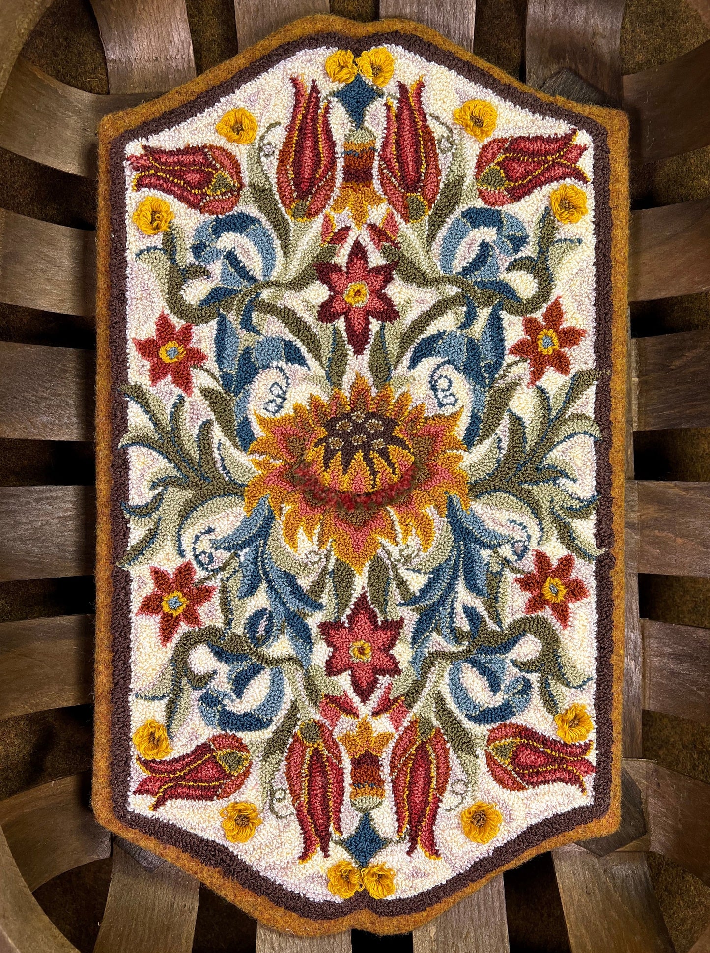 Delight- Punch Needle Pattern by Orphaned Wool. Available as a Paper Pattern and as a Pattern on Weaver's Cloth fabric. This elegant pattern was inspired by the Arts and Craft Movement. Included with the pattern is the full-color thread placement guide and instructions. Created with Valdani threads used in the background and DMC Floss for the flowers and leaves in the design. Copyright © 2022 Kelly Kanyok / Orphaned Wool