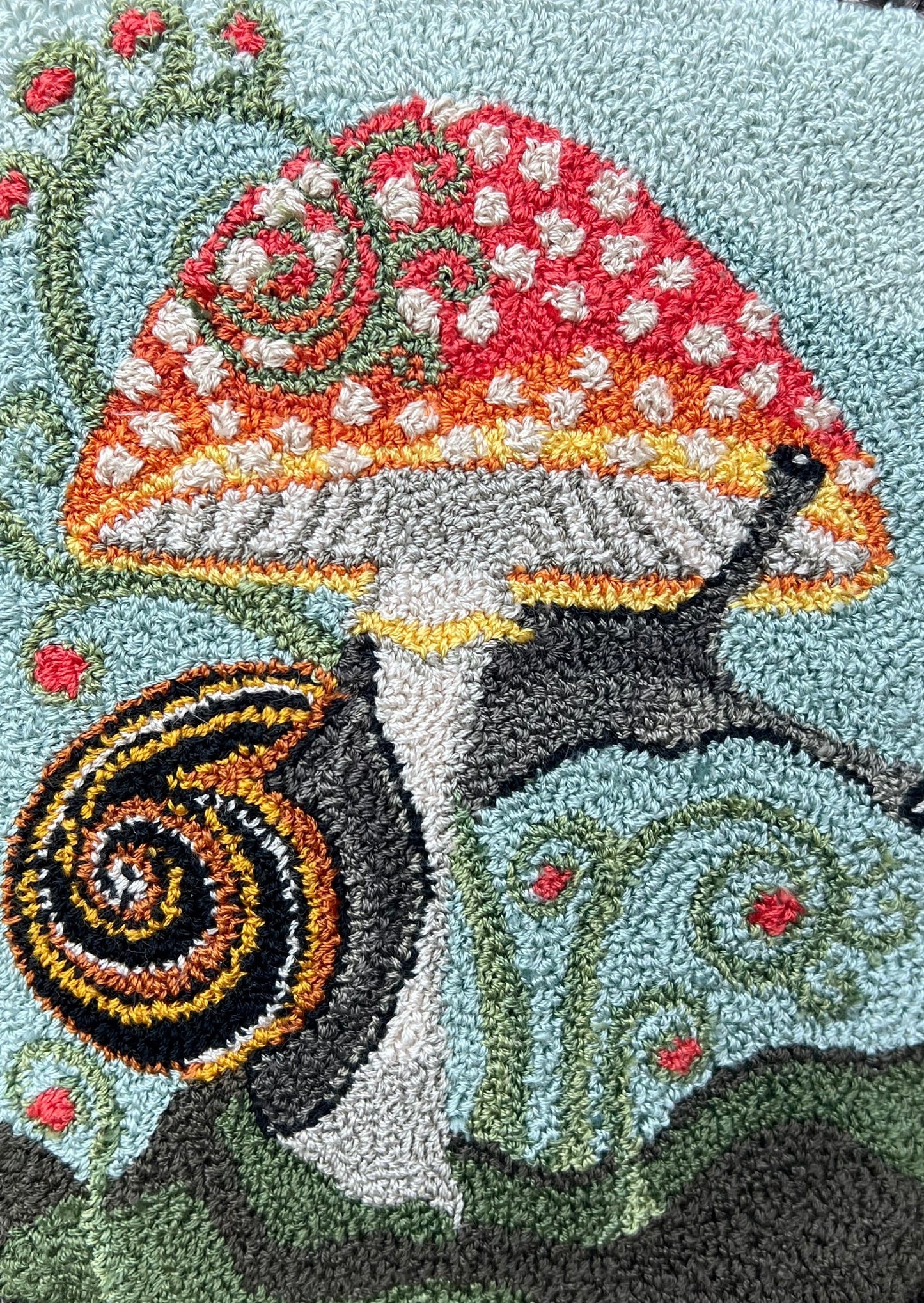 Presenting the enchanting "ENTWINED" Paper Rug Hooking Pattern by Orphaned Wool. This delightful design showcases a charming snail gracefully wrapping around a vibrant mushroom. This fabulous paper pattern offers you the opportunity to bring the wonders of nature to life and create the perfect size pattern you desire. The Entwined pattern is copyrighted 2024 Kelly Kanyok, Orphaned Wool.