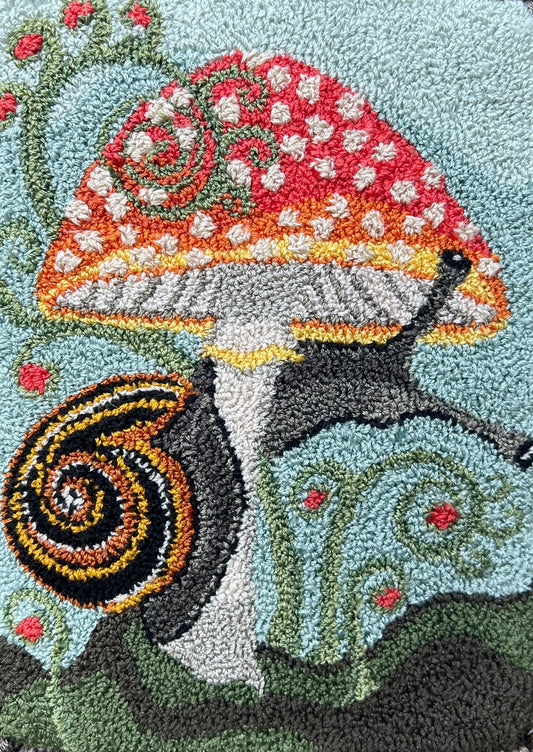  Presenting the enchanting "ENTWINED" Paper Rug Hooking Pattern by Orphaned Wool. This delightful design showcases a charming snail gracefully wrapping around a vibrant mushroom. This fabulous paper pattern offers you the opportunity to bring the wonders of nature to life and create the perfect size pattern you desire. The Entwined pattern is copyrighted 2024 Kelly Kanyok, Orphaned Wool.