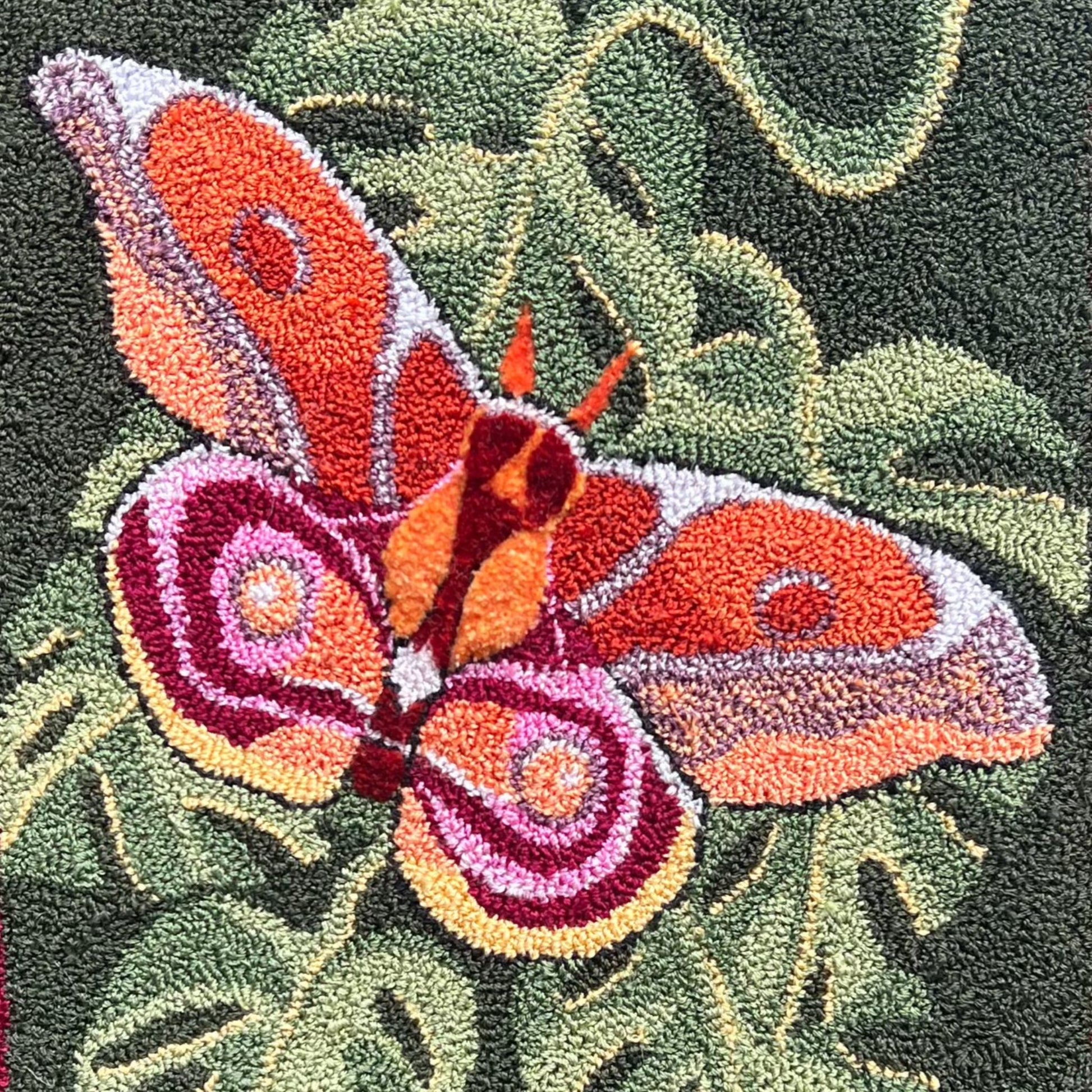 The Bullseye Moth PDF Rug Hooking Digital Download Pattern by Orphaned Wool, copyright 2023 Kelly Kanyok. Create a stunning pillow, rug or wall hanging with this Bullseye Moth design.