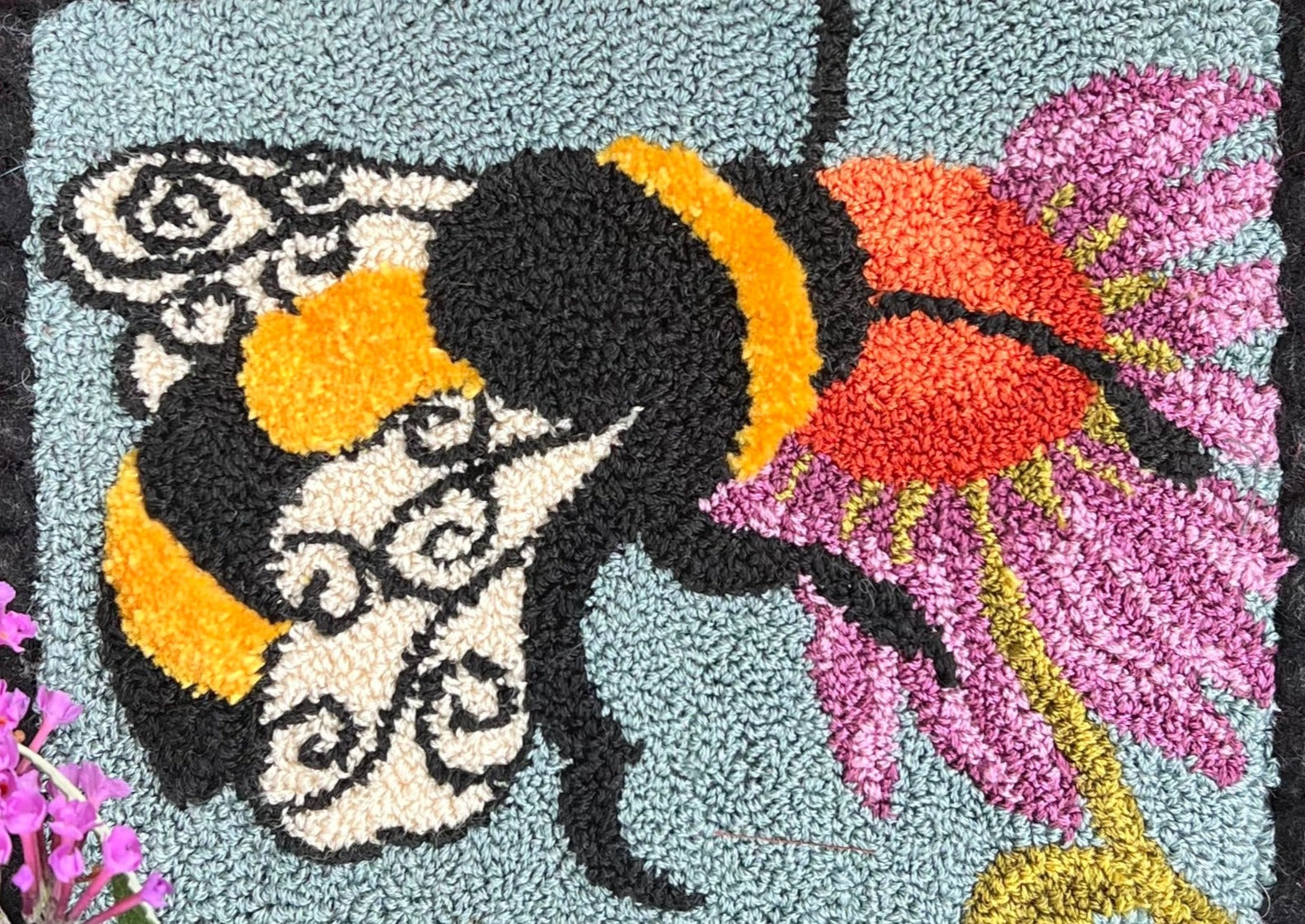 A Bee's Kiss- Paper Rug Hooking Pattern, by Orphaned Wool, Copyright © 2023 Kelly Kanyok. This is a beautifully designed pattern of a bumblebee feeding from a colorful flower. Paper patterns are designed for enlargement.