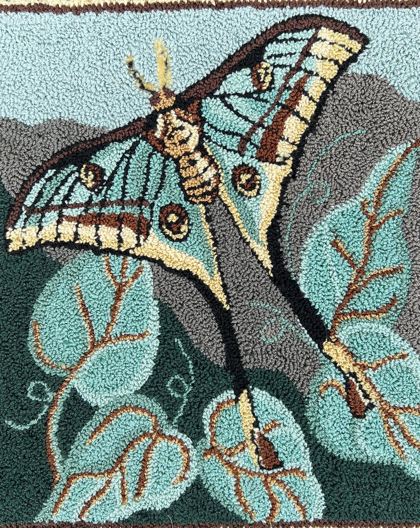 The Spanish Moon Moth Needle Punch Pattern by Orphaned Wool, Copyright © 2023 Kelly Kanyok. Create the nature-inspired design of a Spanish Moon Moth in flight. Available are a Paper Pattern or Printed on Cloth ready to go on your frame or hoop.