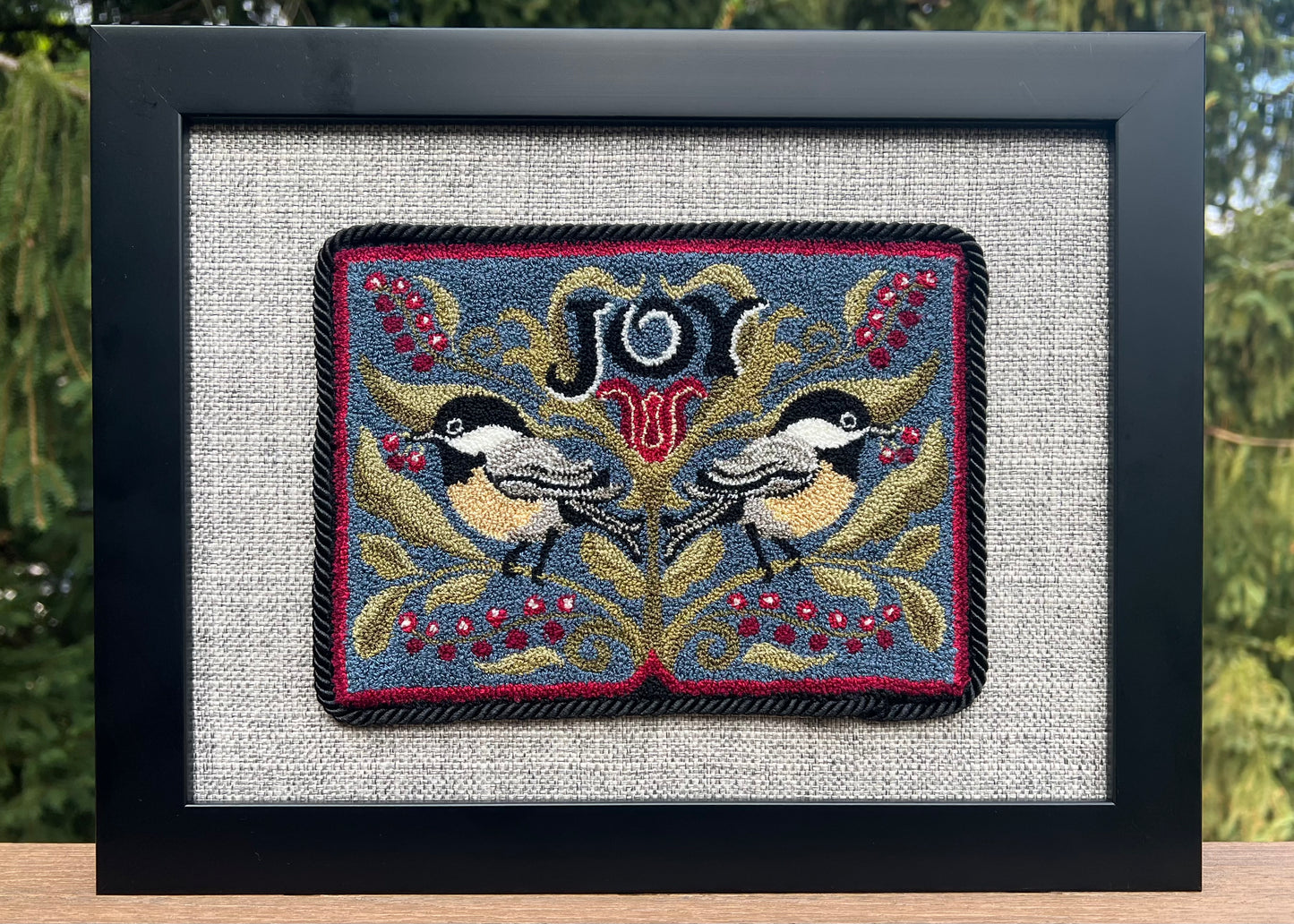 Chickadee Joy punch needle pattern featuring two chickadees and winter berries