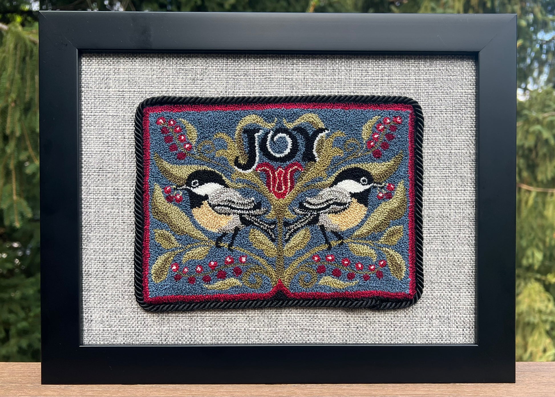 Chickadee Joy punch needle pattern featuring two chickadees and winter berries
