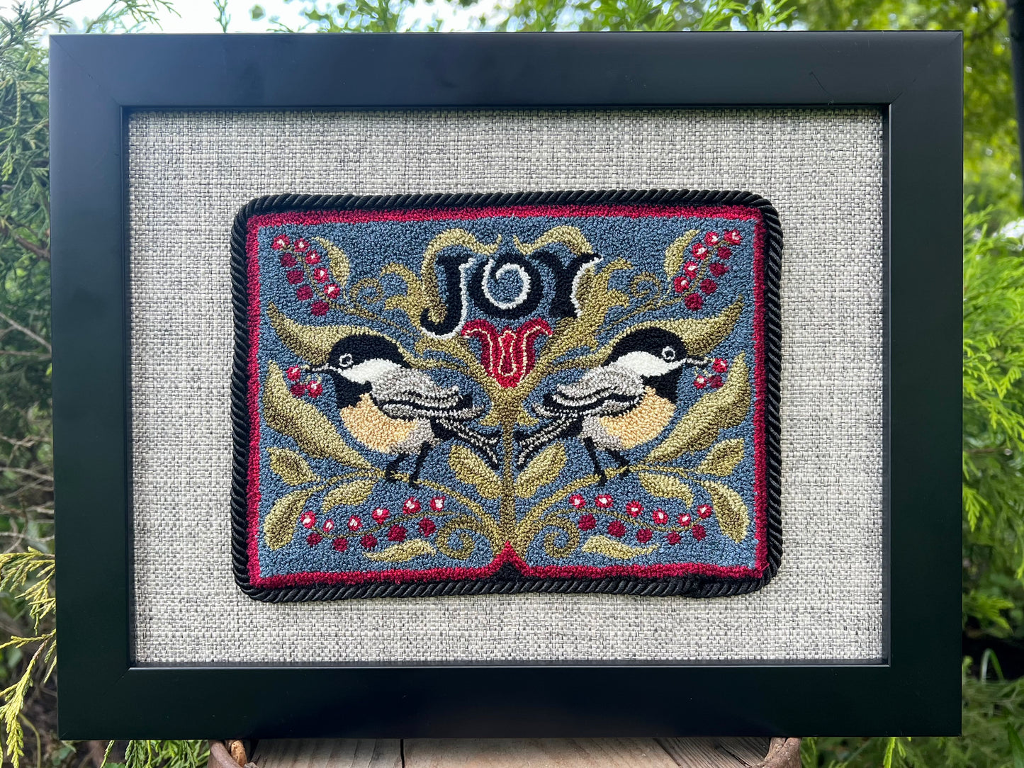 Chickadee Joy punch needle pattern featuring two chickadees and winter berries