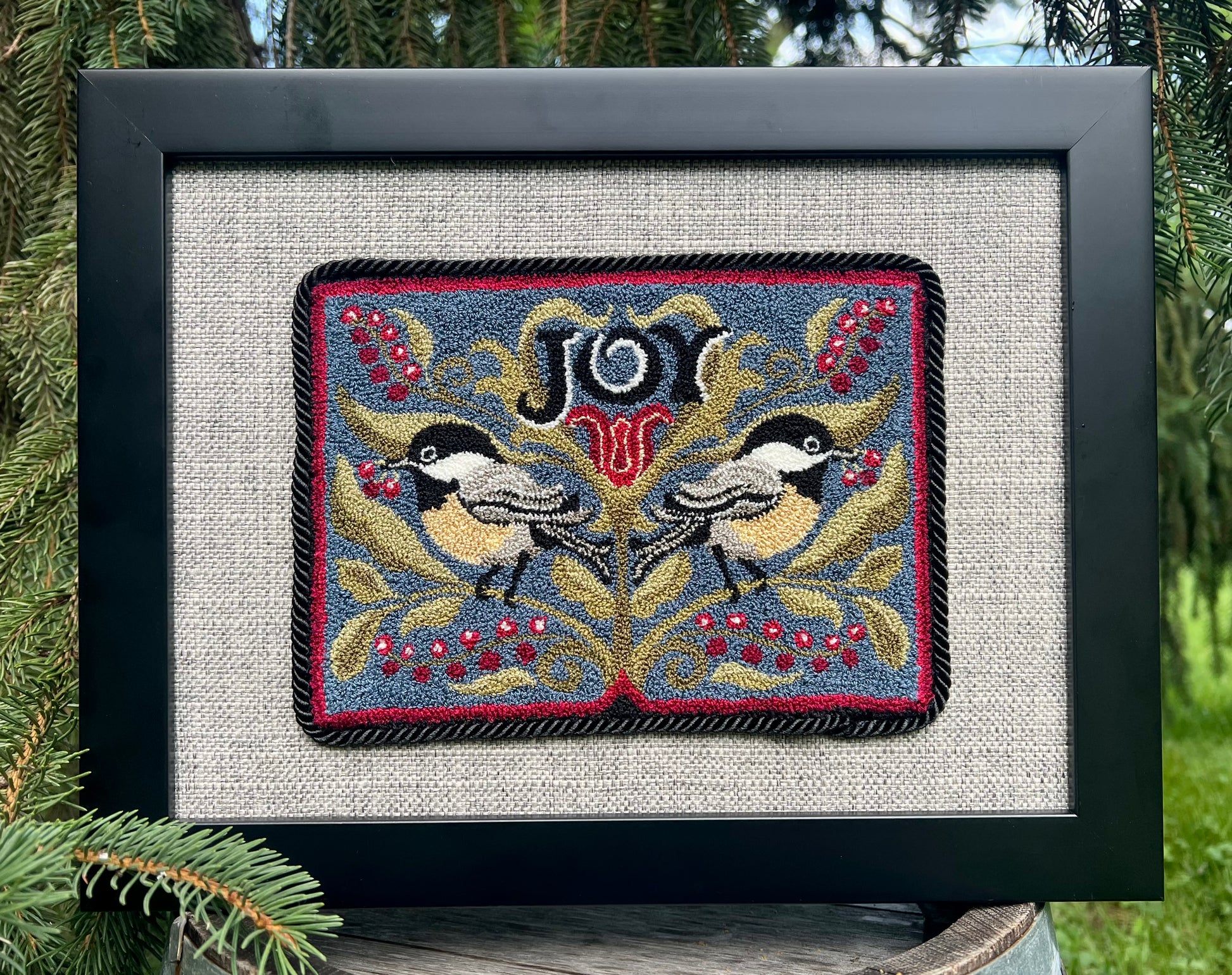 Chickadee Joy punch needle pattern featuring two chickadees and winter berries