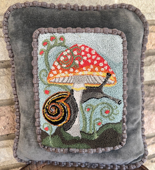  The Pattern Entwined is a punch Needle Embroidery pattern that used thread and a punch needle to create the design. Entwinted design depicts a snail wrapping itself around a colorful mushroom. Copyright © 2024 Kelly Kanyok of Orphaned Wool.