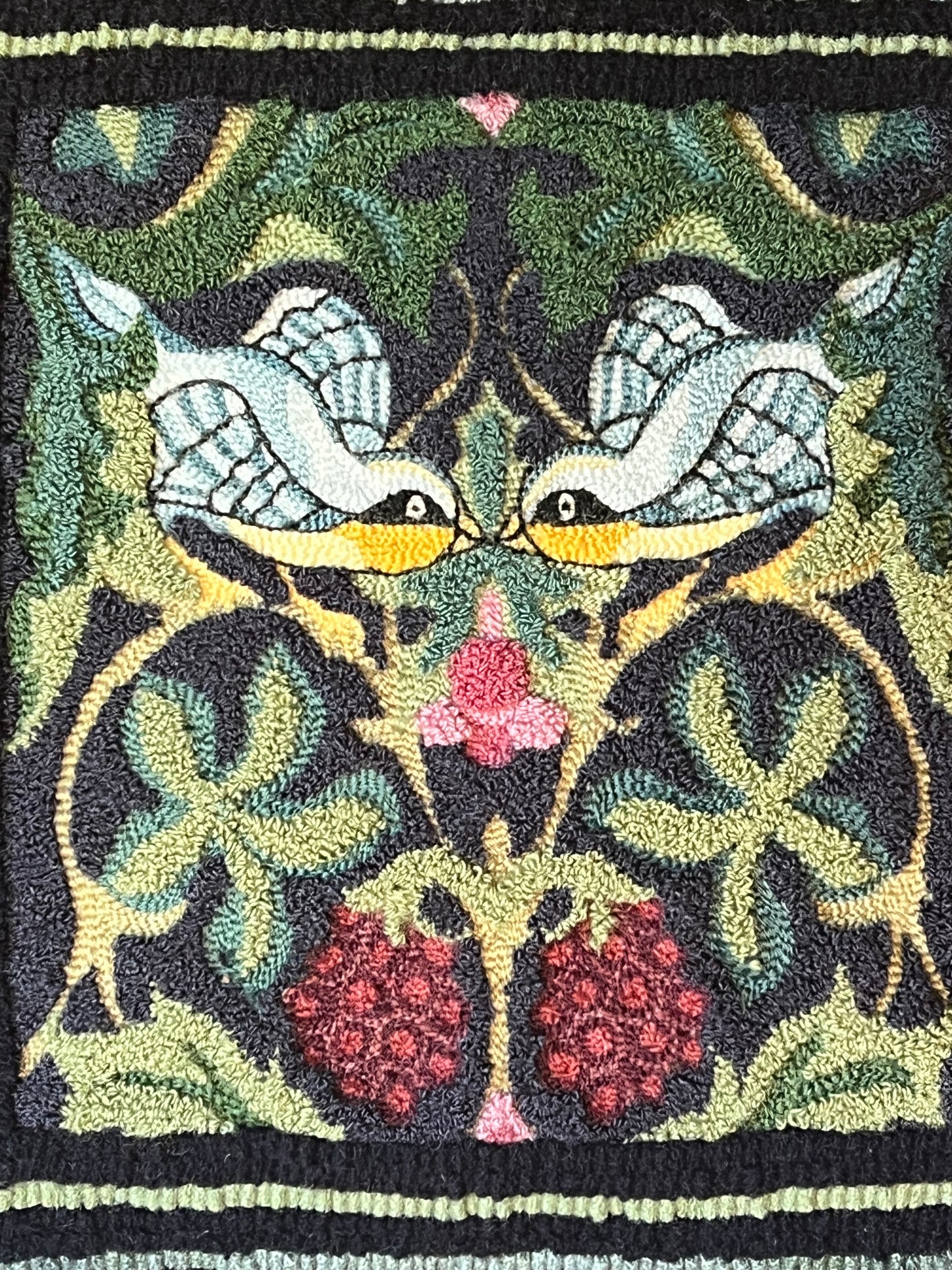 Whispering Wings is a punch needle PDF digital download file from Orphaned Wool, Copyright  2024 Kelly Kanyk. This design features two birds amongst the foliage and grapes, and includes directions to create this pattern as dimensional or normal punch needle pattern.