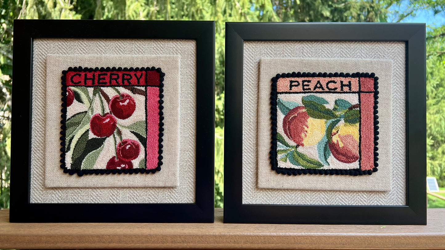 Peach- Punch Needle Pattern by Orphaned Wool, Copyright ©2025 Kelly Kanyok. Available in paper, cloth, printed patterns, or a set of four patterned designs (Fruit Series). The pattern features two colorful peaches with the word "PEACH" at the top of the design. Cherry pattern sold separately 