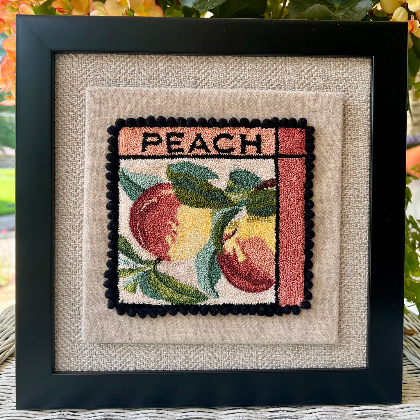 Peach PDF Punch Needle Digital Download pattern by Orphaned Wool, copyright 2025 Kelly Kanyok. This pattern features two colorful peaches along with the word PEACH.