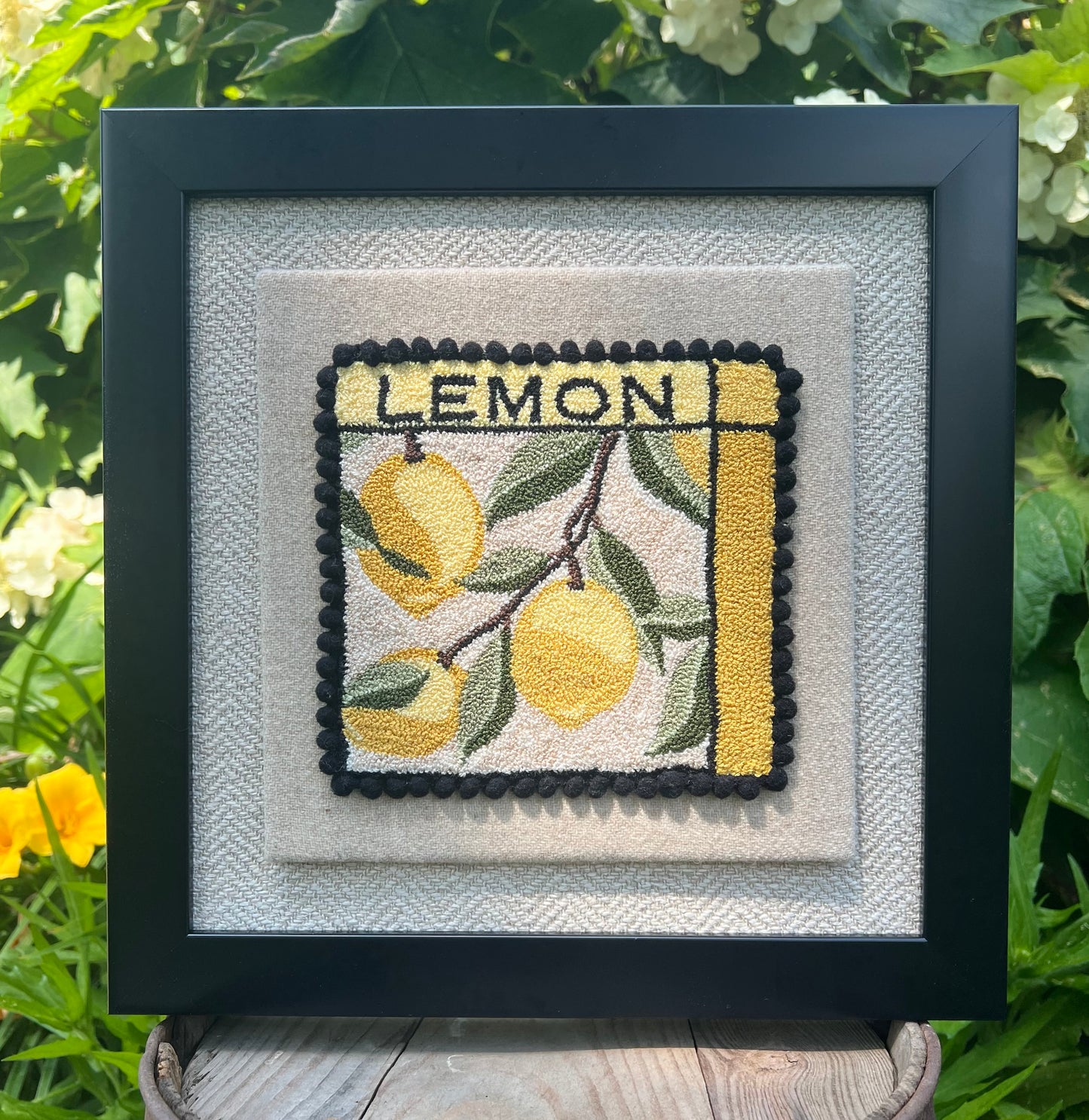 Lemon -Punch Needle Pattern, Paper, printed on cloth, or fruit series set option, by Orphaned Wool, Copyright 2025 Kelly Kanyok. This is a 5 1/2 x 5 1/2 punch needle pattern featuring three lemons on the vine with the word 'LEMON' at the top.