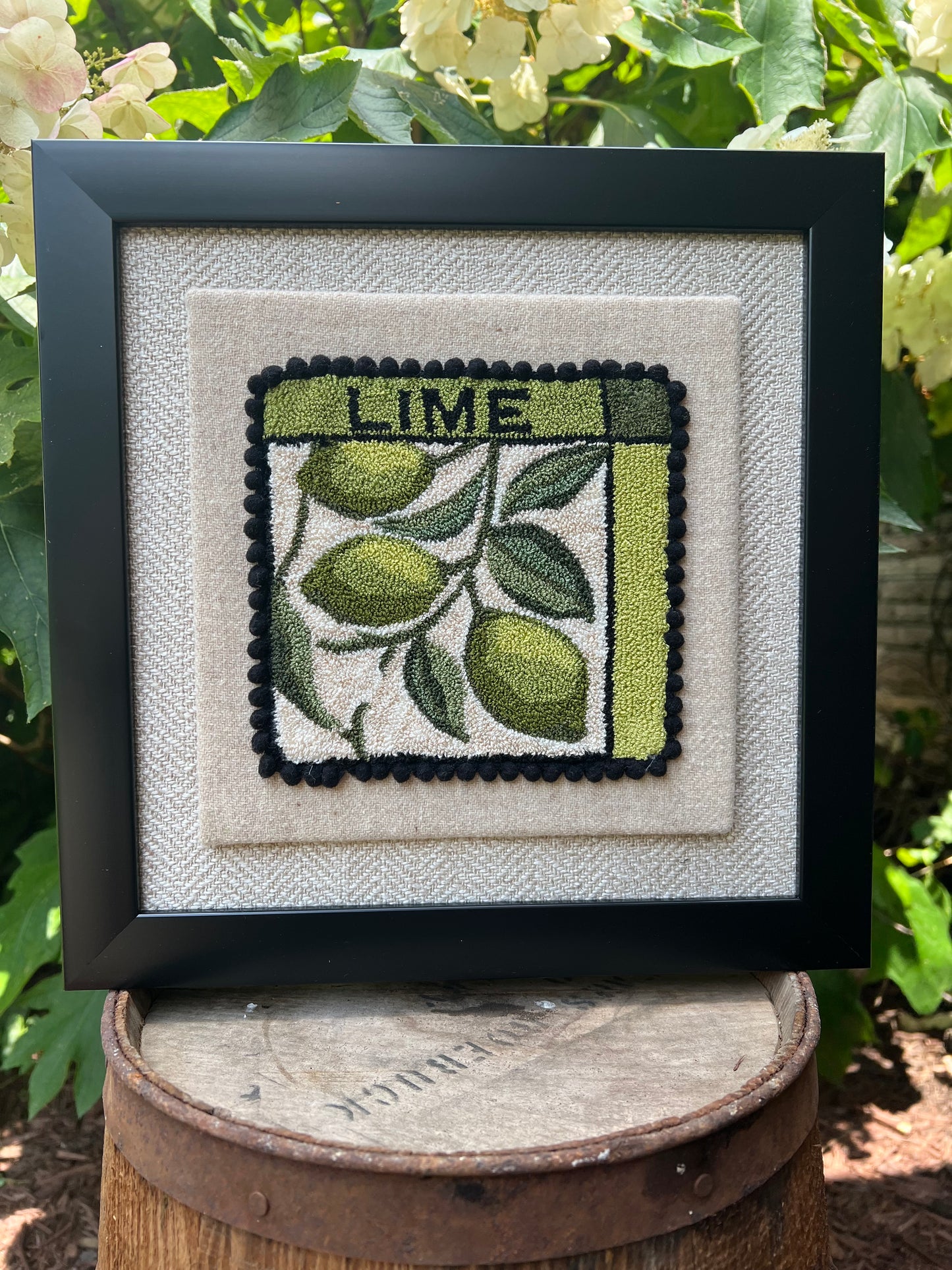 Lime Punch Needle Pattern, Paper or Printed on Cloth options, by Orphaned Wool, copyright 2025 Kelly Kanyok. Pattern features a series of three limes hanging from a vine with the word LIME at the top of the design.