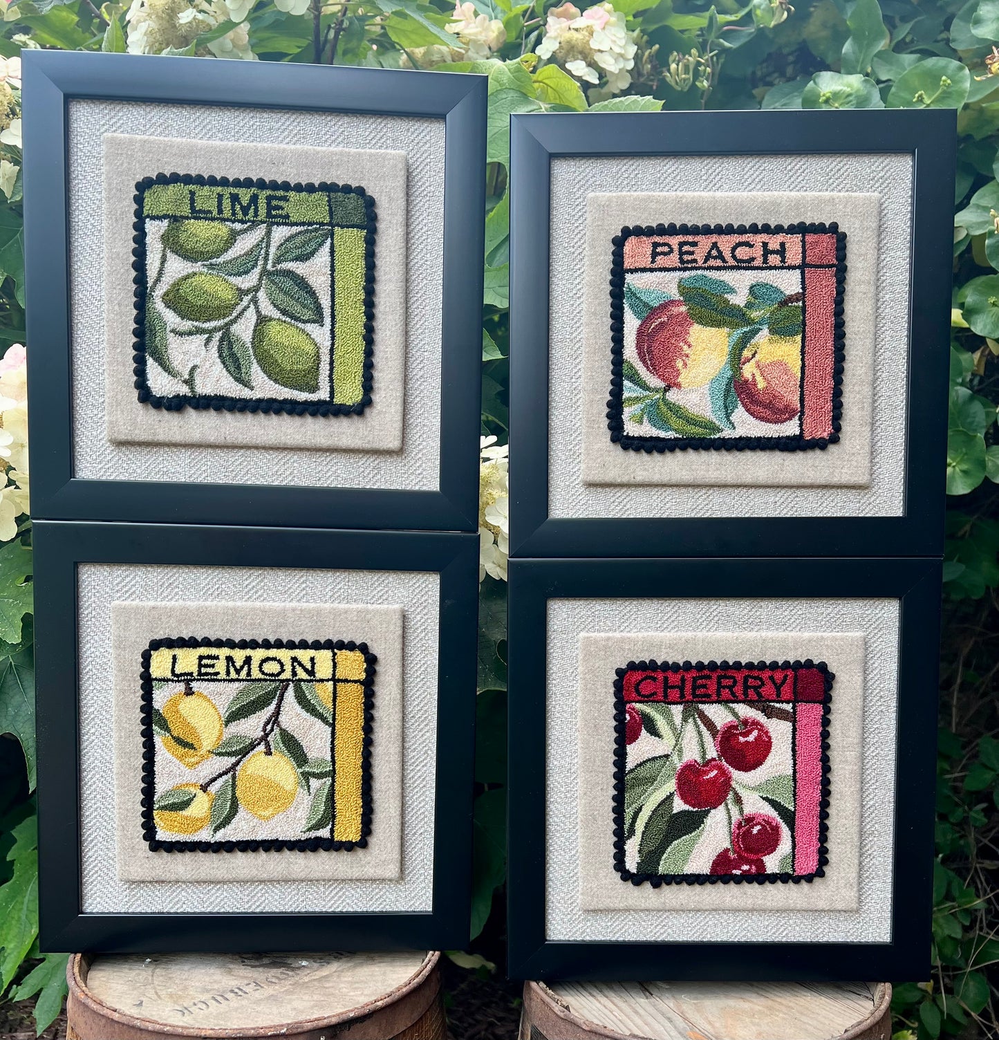 Peach- Punch Needle Pattern by Orphaned Wool, Copyright ©2025 Kelly Kanyok. Available in paper, cloth, printed patterns, or a set of four patterned designs (Fruit Series). Pattern features  two colorful peaches with the word PEACH at the top of the design. Fruit Series set- sold individually Lemon, Lime, Peach and cherry