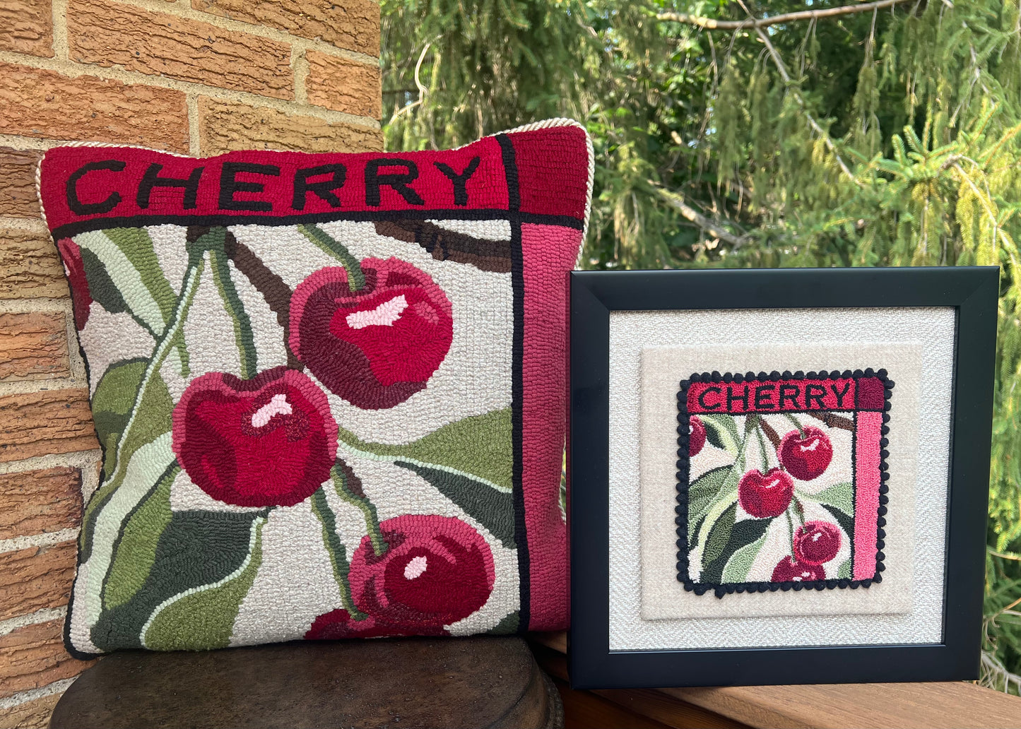 Cherry paper rug hooking pattern by Orphaned Wool, copyright © 2025 Kelly Kanyok. This paper pattern is designed to be enlarged. This picture shows the finished design enlarged 300% to create a beautiful pillow. The design features cherries with the word cherry on top. This pattern is part of a set of four fruit patterns available. Sold individually or as a set of four. Lemon, Lime, Peach, and Cherry designs.- Also available as a punch needle pattern (Sold Separately)