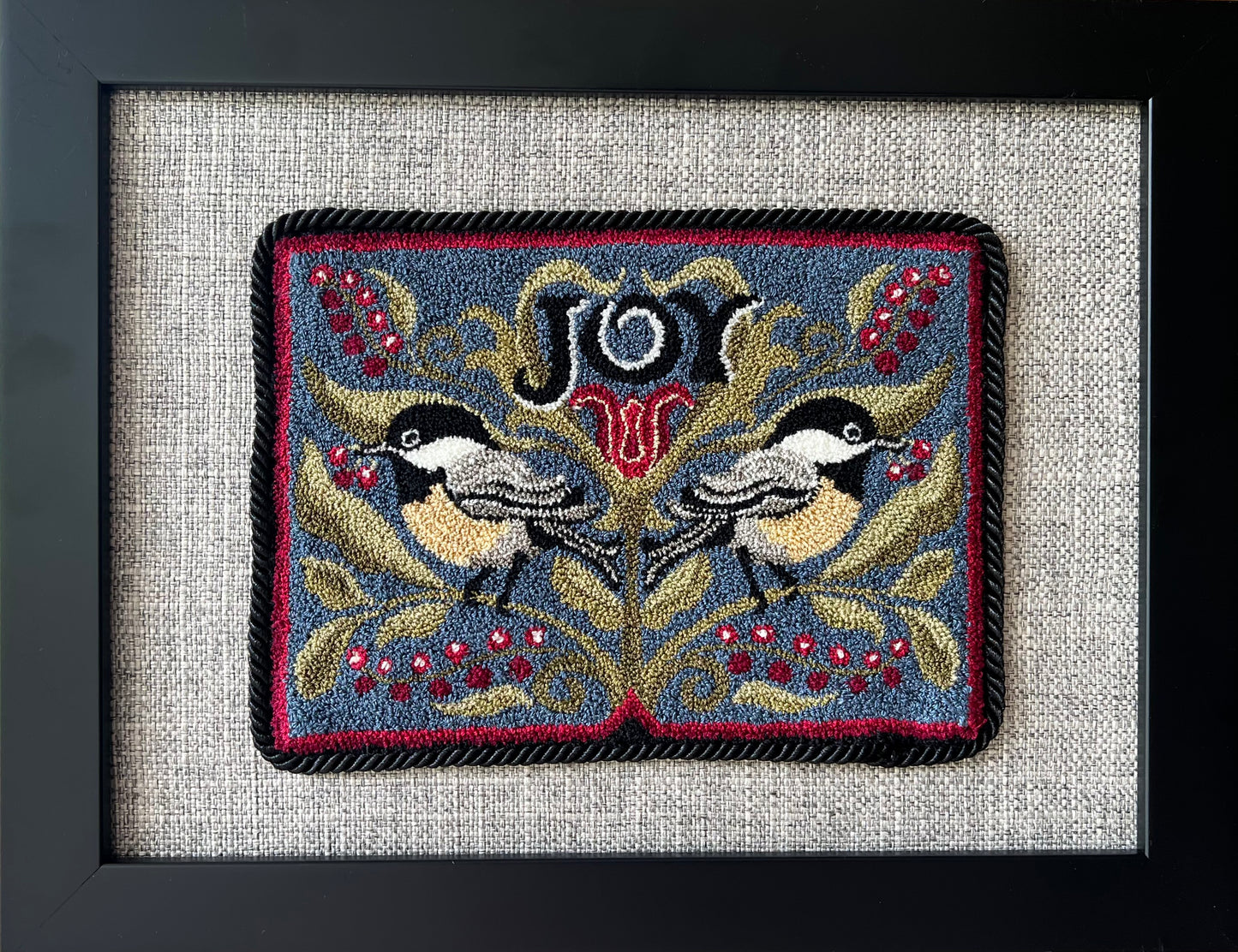 Chickadee Joy punch needle pattern featuring two chickadees and winter berries