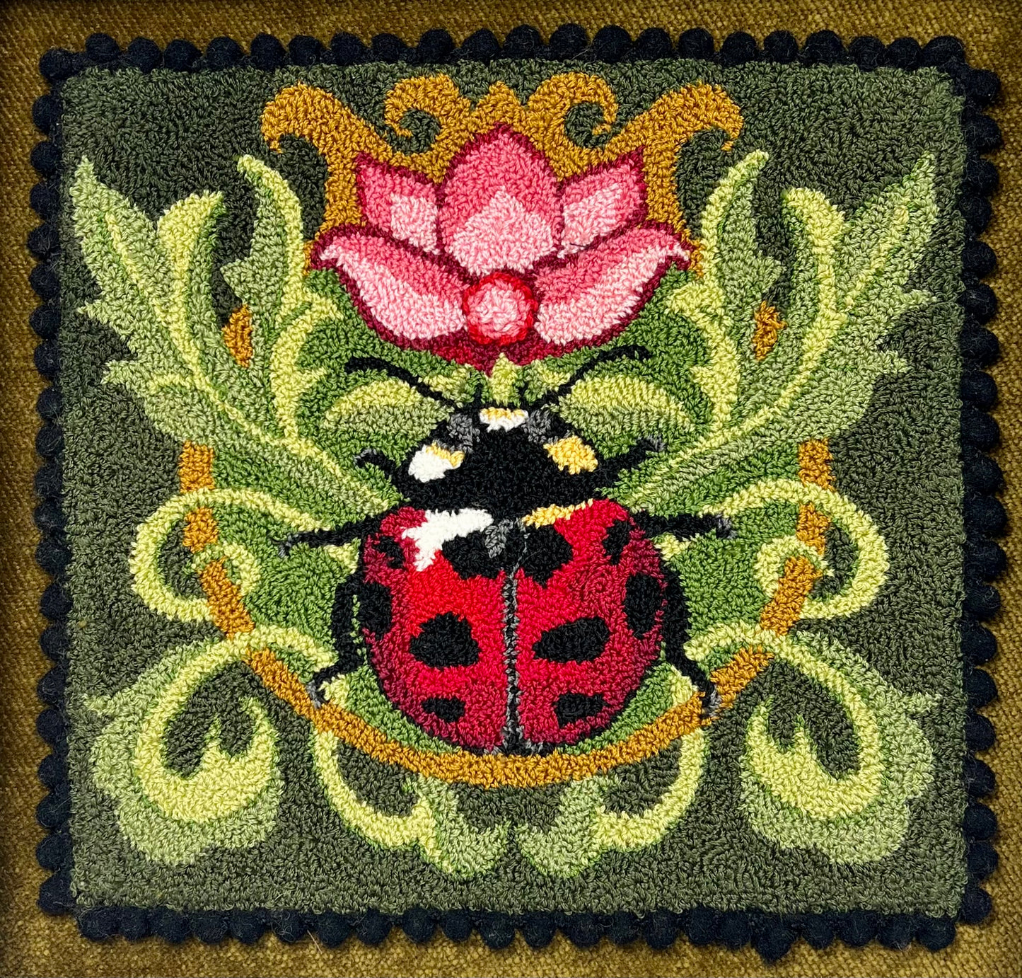 Ladybug Design on Leaves with a rose colored flower design by Orphaned Wool