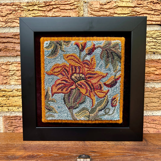 Lily punch needle pattern by Orphaned Wool, copyright 2024 Kelly Kanyok. This Floral Pattern of a Lily was completed using Valdani Threads. The pattern size is 6 x 6 and is available as a paper or pre-printed on weaver' cloth pattern.