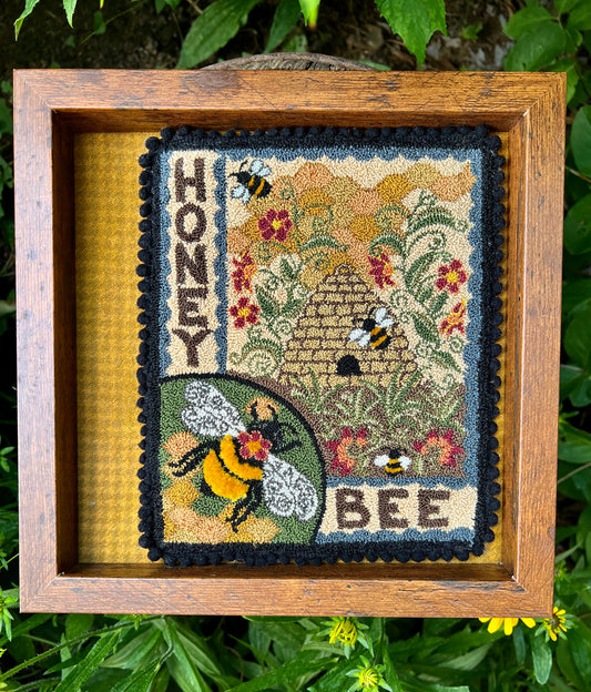 Honey Bee Punch Needle Pattern by Orphaned Wool is a wonderful pattern for all the bee lovers out there. This design can be completed using DMC Floss. The sweet bumblebees and bee skep with the honeycomb and flowers is a delightful pattern to create. Pattern are available as Paper Patterns and Pattern on Weavers Cloth.