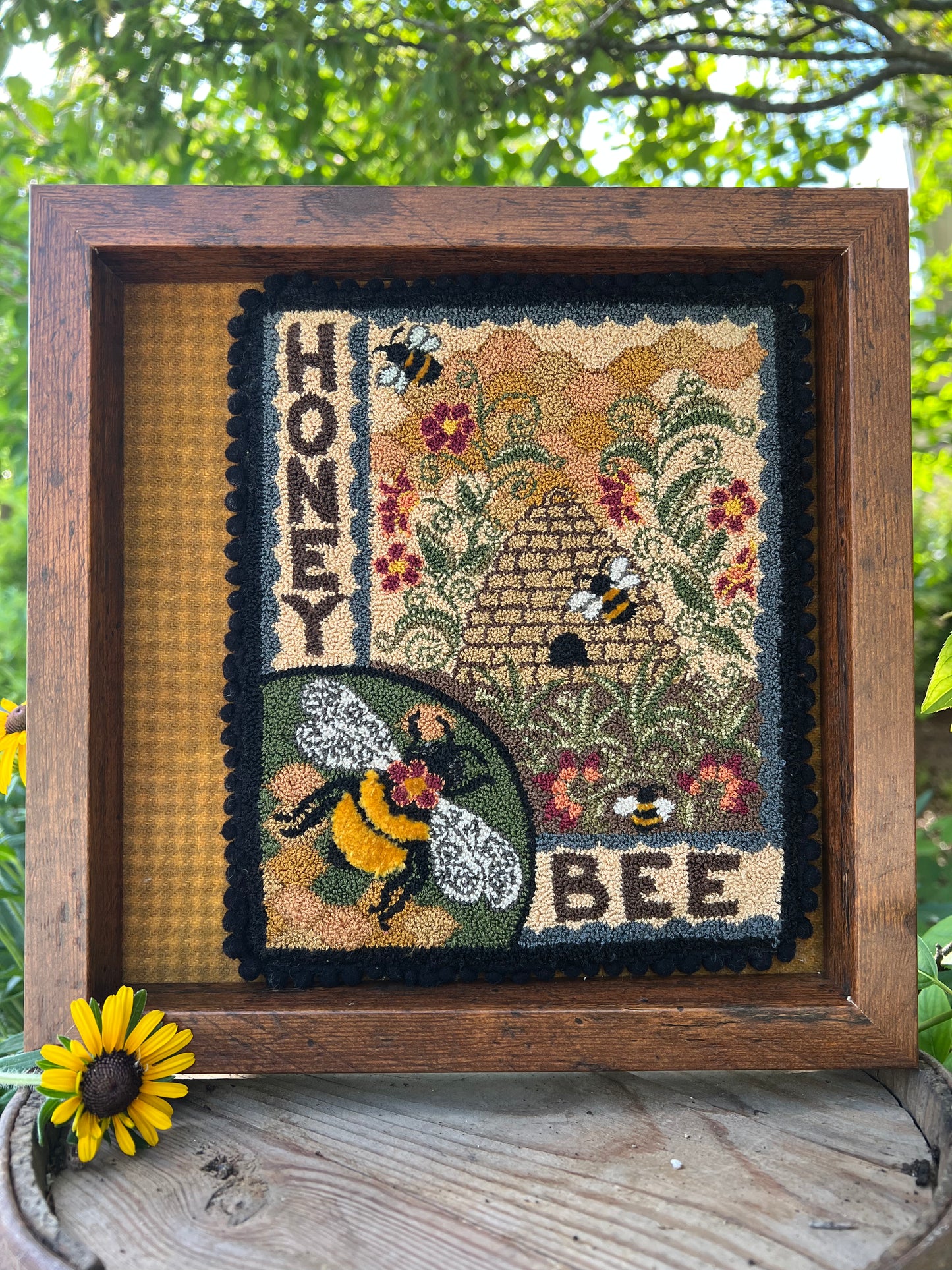 Honey Bee Punch Needle Pattern by Orphaned Wool is a wonderful pattern for all the bee lovers out there. This design can be completed using DMC Floss. The sweet bumblebees and bee skep with the honeycomb and flowers is a delightful pattern to create. Pattern are available as Paper Patterns and Pattern on Weavers Cloth.