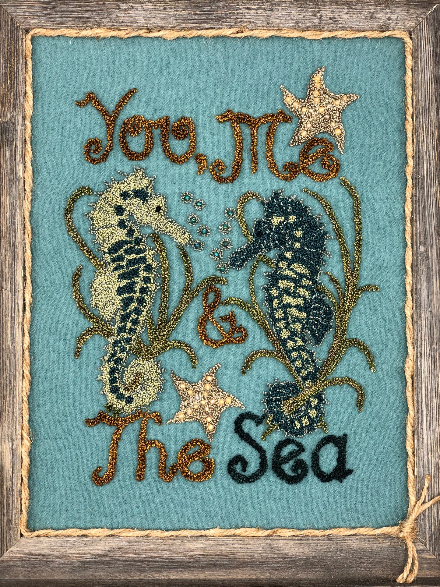 You, Me & The Sea- PDF Digital Download Punch Needle Pattern by Orphaned Wool. This wonderful under the sea pattern was created using wool fabric as the background fused with the weaver's cloth pattern. Small beads were also used to create the bubble effects.