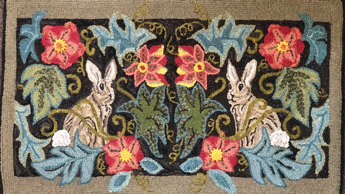 Rabbits in the Garden- Rug Hooking or Rug Punch Needle Pattern by Orphaned Wool. This design is hand-drawn of natural Linen. Enjoy these sweet bunnies facing each other with flowers and foliage.